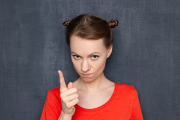 Portrait of dissatisfied woman making reprimand or rebuke