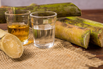 Cacha&ccedil;a is the name of a typical alcoholic drink produced in Brazil maked with sugarcane. Traditional drink from Brazil on wooden table
