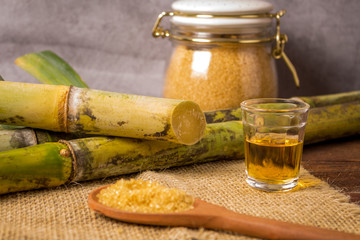 Cacha&ccedil;a is the name of a typical alcoholic drink produced in Brazil maked with sugarcane. Traditional drink from Brazil on wooden table