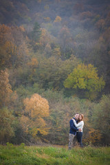 Fototapeta na wymiar Couple having fun outside, autumn vibes. Outdoors, nature, romantic concept