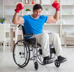 Disabled boxer at wheelchair recovering from injury