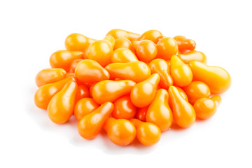 Bunch of ripe orange grape tomatoes isolated on white background. side view.