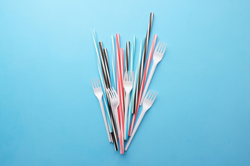 Plastic garbage on blue background. Ecological, environmental pollution, recycling and zero waste...