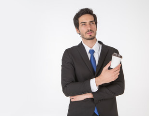 Handsome business man with a coffee cup during take a  break and refresh white background.