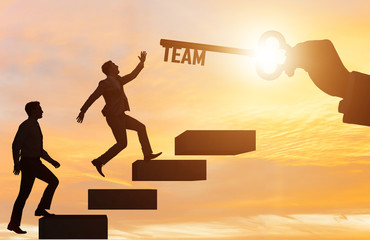 Businessmen on career ladder in teamwork concept