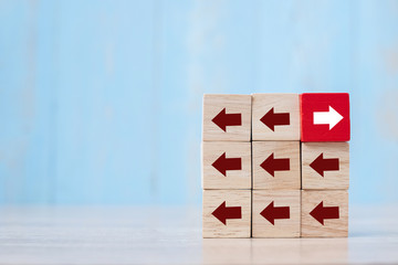 Red block with different direction of arrow on table background. Business Growth, Improvement, strategy, Successful, different and Unique Concepts