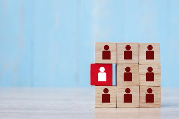 Red wooden block with white person icon on the building. People, Business, Human resource management, Recruitment, Teamwork, strategy and leadership Concepts