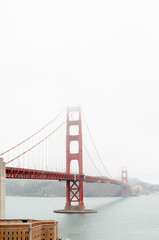 Fototapeta na wymiar Golden Gate into the fog