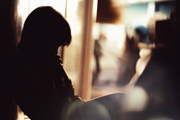 little child sitting thinking to something with loneliness.