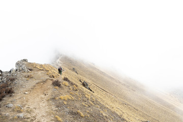 lost in the mist, on the way of trekking to tserko ri peak, nepal