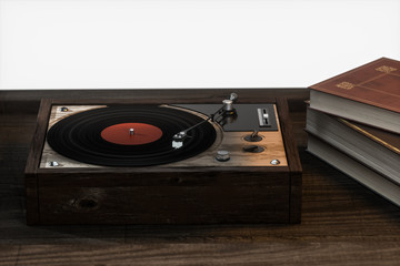 The old wooden vinyl record player on the table, 3d rendering.
