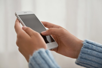 Woman with modern mobile phone, closeup