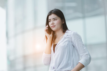 Fototapeta premium Asia woman using smartphone working playing with fun and happy in free time.