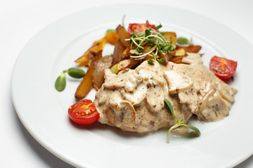 mushrooms in sauce with potatoes and a vegetables