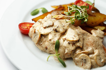 mushrooms in sauce with potatoes and a vegetables