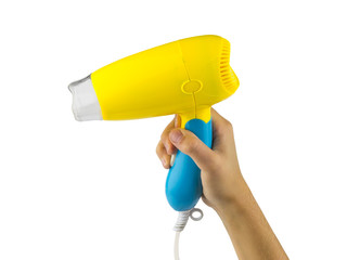 Hand with yellow-blue hair dryer isolated on white background.