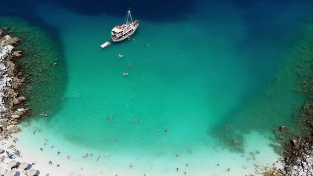Drone Marble Beach Footage with Boat, Blue and Green Water, on Thassos Island, Greece, Saliara Beach.