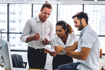 Successful group of casual business discussing and working with laptop computer.creative business people planning and brainstorm in modern office.Teamwork concept