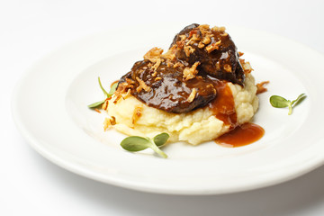meat with potato puree on a white background