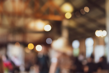 Blur coffee cafe with customers background vintage tone color style.