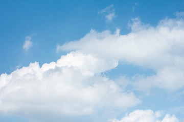 White cloudy with blue sky background.