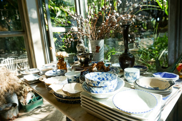 many vintage thai ceramic table ware on table