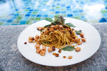 Spaghetti Bacon Spicy with Pool Background
