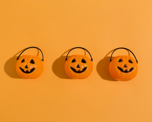 Halloween pumpkins overhead view on a solid color