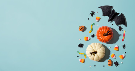 Pumpkins with Halloween decorations - overhead view flat lay
