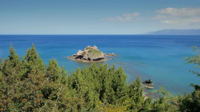 beautiful small stone island in mediterranean sea near Cyprus coast in summer day