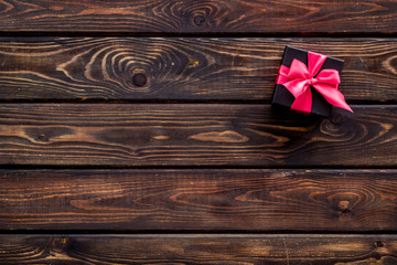 presents in boxes on wooden background top view copyspace