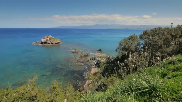 clear transparent water of warm sea, view from hill in sunny day