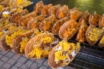 Thai dessert sweetmeat or Thai crispy pancake, topped with sweet egg floss.