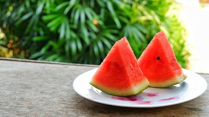 Closeup watermelon on wooden table with nature background