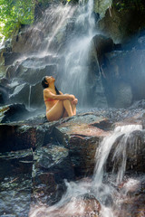 Fototapeta na wymiar natural portrait of young beautiful and happy Asian Korean woman in bikini enjoying nature at tropical paradise waterfall with magical feeling in soul inspiration