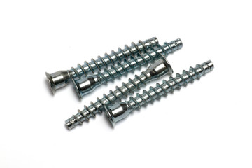 Close-up on screws, metal screws, iron screws, wood screws isolated on white background