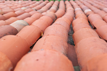 Roofing tile element of roof tile pattern on house.