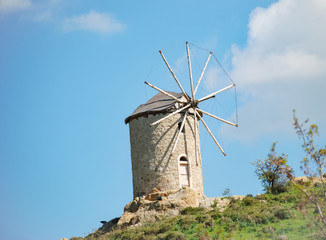 Fototapeta na wymiar Windmill at the hill of Foca Town.