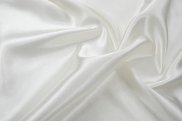 Delicate satin draped fabric white texture for festive backgrounds