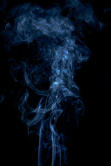 Blue smoke on dark background
