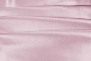 Delicate satin draped fabric pink texture for festive backgrounds