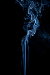 Blue smoke on dark background