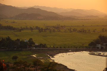 Dreamy scenery of the aerial view as the hazy sunset descend over Lak Lake in Lien Son, Dak Lak, Vietnam