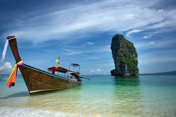 Traditional longtail boat and Poda island, Thailand.