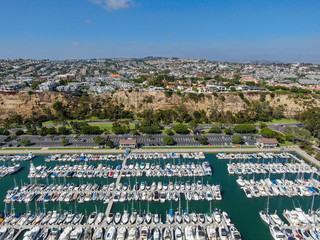 Aerial view of Dana Point Harbor and her marina with yacht and sailboat. southern Orange County, California. USA