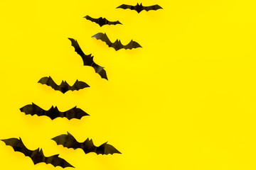 Halloween design. Bats on yellow background top view space for text