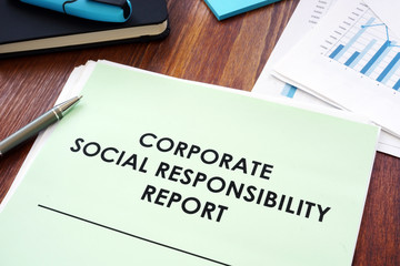 Corporate social responsibility report on the table. - obrazy, fototapety, plakaty