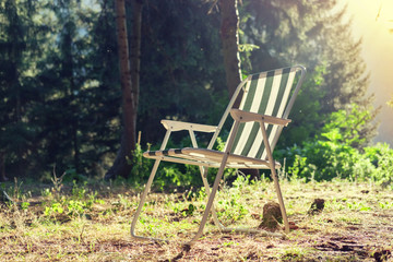 Striped chaise longue on the field