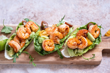 Lettuce wrapped Shrimp tacos with fresh tomato, avocado and lime