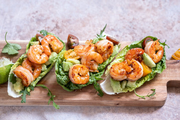 Lettuce wrapped Shrimp tacos with fresh tomato, avocado and lime